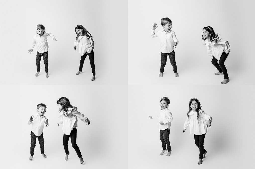 siblings dancing during a simple mini session. Black and white photography session. Kids photographer rochester, michigan